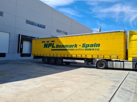 Yellow truck at warehouse